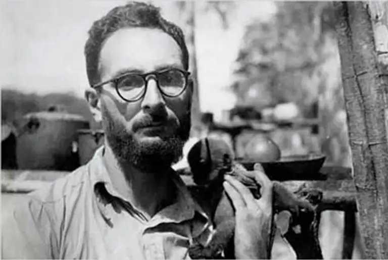 Marcel Mauss as a young man, holding an ethnographic artifact