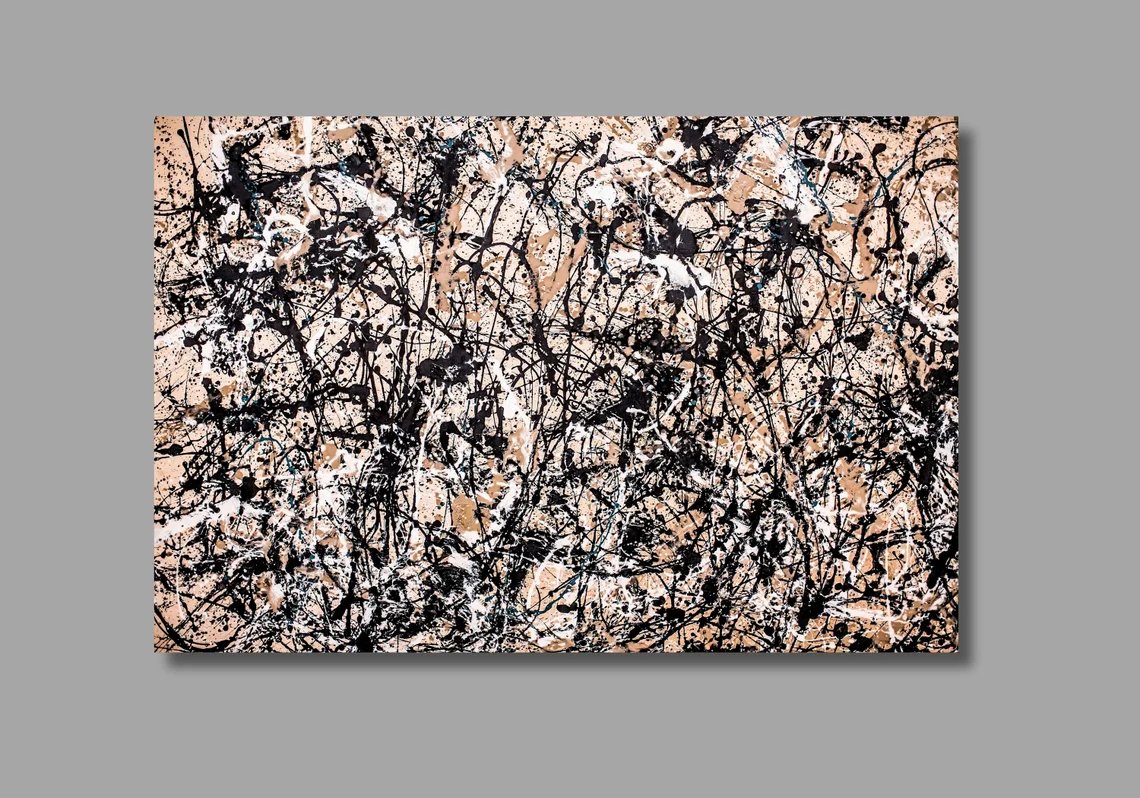 Jackson Pollock drip painting in black, white, and beige tones on a gray background